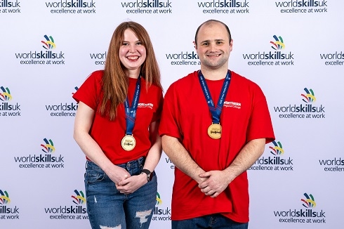 Male and female with gold medals