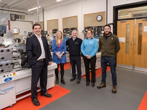 Group standing in engineering facilities