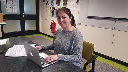 Female student sitting at a laptop