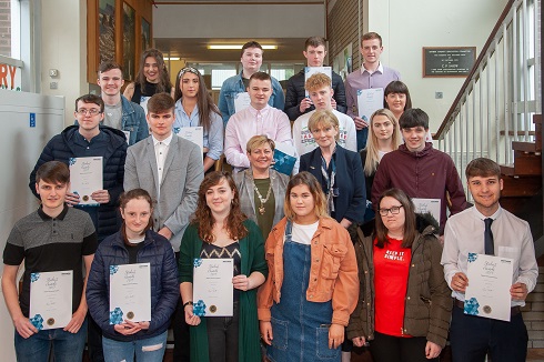 Group of students holding certificates