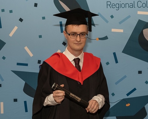 Male wearing graduation robe