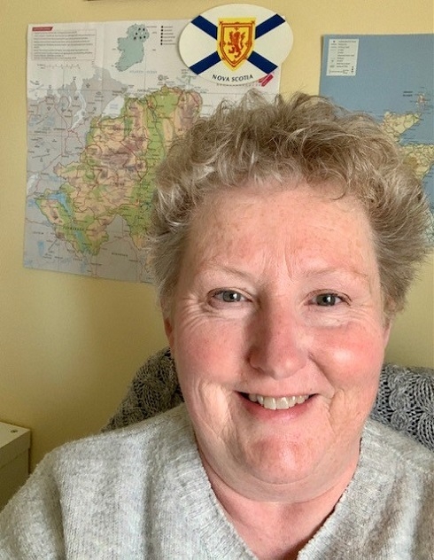 Female pictured in front of a map