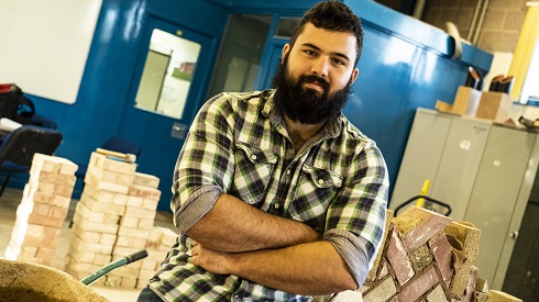 Male student in bricklaying workshop