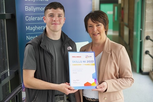 Male and female holding a certificate