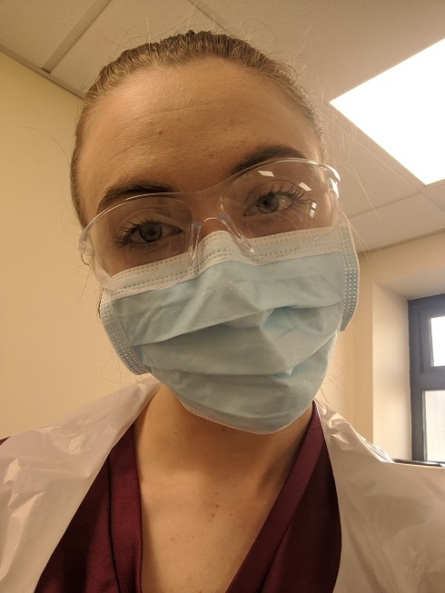 Girl in healthcare setting with facemask