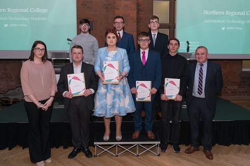 Group of students on stage with their certificate