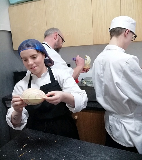 Catering student in kitchen