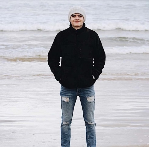 Male standing on the beach
