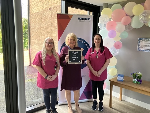 Group of females holding a plaque