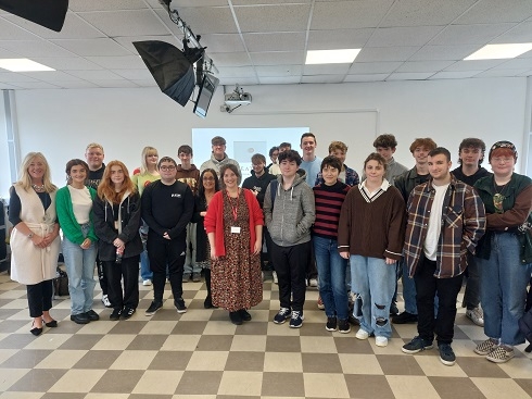 Group standing in TV studio