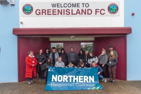Group of students standing outside Greenisland Football Club