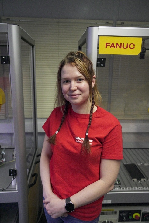 Female in robotic workshop