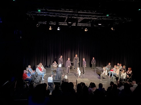 Group of students performing in dance theatre