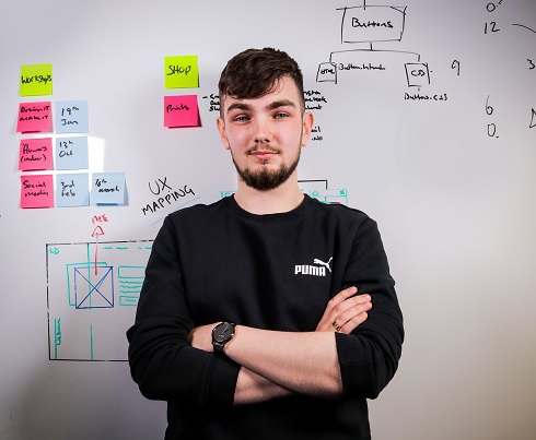 Male student in front of whiteboard