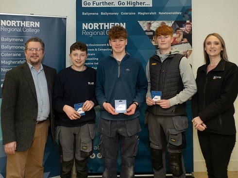 Group of students with awards