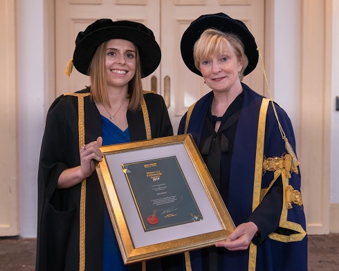 Principal & Chief Executive presenting award to Honorary Fellow