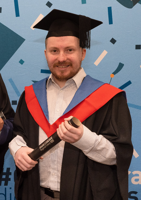 Male in graduation gown