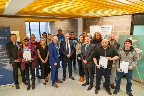 Group of people holding certificates