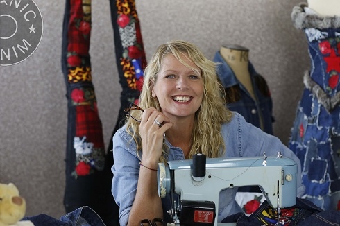 Female sitting at sewing machine