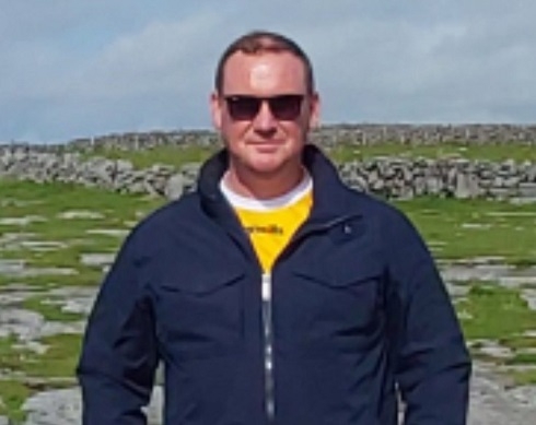 Male standing outside