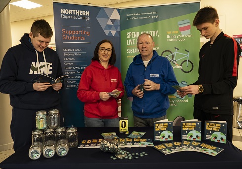 Staff with students at NASMA exhibition stand