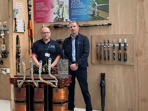 Two men in workshop with tools