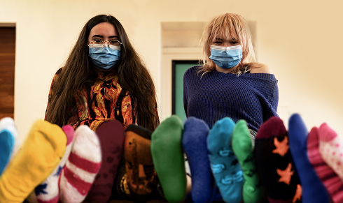 Two female students wearing bright coloured socks