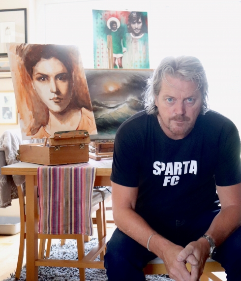 Man with piece of artwork