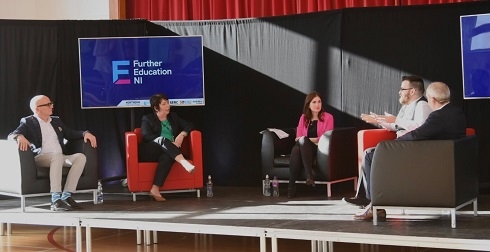Female and male panel on stage