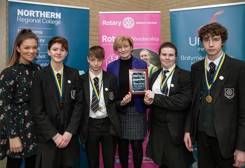 Group of school pupils pictured with their award alongside the Principal of the College