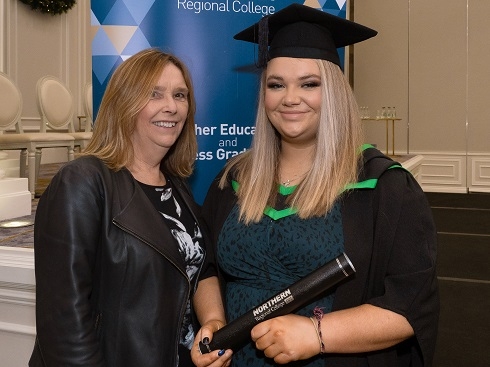 Mother pictured with her daughter at graduation