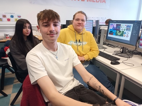 Group of students sitting at computer