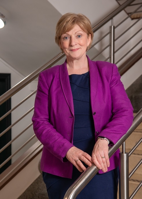 Female standing on stairs