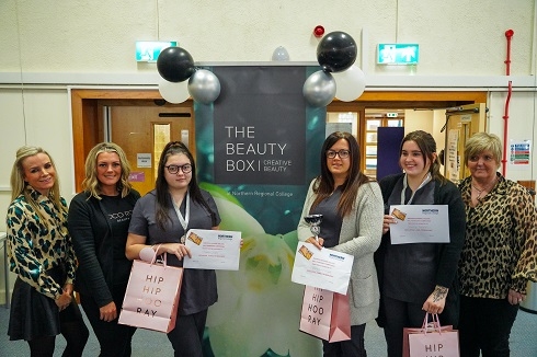Group of females holding certificates