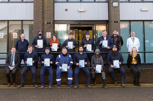 Group of students holding their certificates