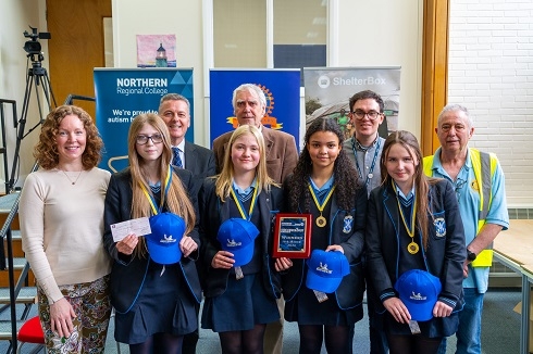 Group of pupils with medals with staff