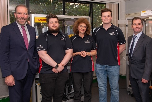 Group standing in workshop
