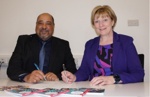 Principle & Chief Executive of the College signing a form